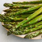 Roasted asparagus on a plate.